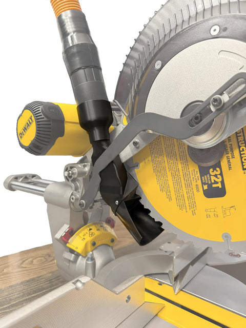 Enhanced Dust Collection Port For DWS779 And DWS780 Miter Saws installed, showing adapters for various hose sizes in a woodworking setup.