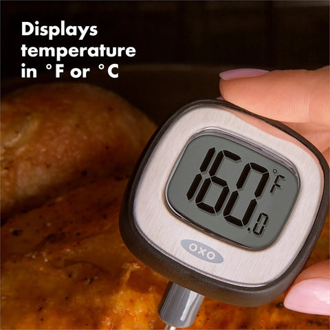 Good Grips Chef's Precision Digital Instant Read Thermometer With 90 Degree Pivot displaying temperature on roasted meat