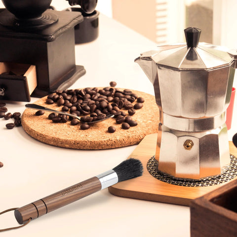 Front view of Takavu coffee grinder cleaning brush with black boar bristles on wooden handle.