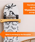 Premium Wooden Vertical Skateboard Wall Mount Rack And Heavy Duty Storage Hanger For Standard Decks displaying skateboard with hanger.