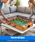 2 In 1 Swivel Mini Game Table Top Wood Foosball And Slide Hockey Combo with players in action on a living room table.