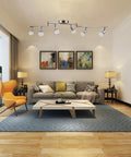 Living room with six light dimmable track lighting kit with flexible foldable arms in satin nickel finish for sleek modern home lighting