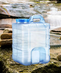 Camping Water Jug With Lid 20L Easy Pour Handle And Wide Mouth Large Opening Portable Water Storage Carrier outdoors on rocks