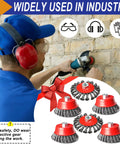 Worker using Four Inch Wire Wheel Brush Set For Grinder Six Pack For Four And A Half Inch Angle Grinder With Five Eighth Inch Eleven Threaded Arbor Coarse Crimped Twisted Knotted Cup Brush Heavy Duty Rust Busting And Surface Cleaning on wall.
