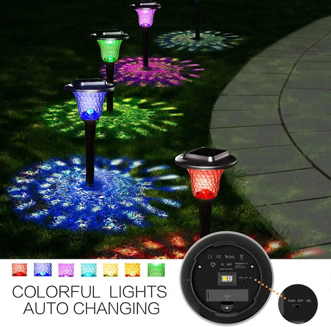 Solar Outdoor Path Lights 6 Pack With Lit Color Changing And Static Warm Glow Modes illuminating a garden pathway