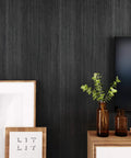 Black Wood Countertop Contact Paper Peel And Stick Waterproof Self Adhesive Faux Wood Grain Vinyl Wrap For Countertops, Cabinets, Walls, And Furniture 15.8 X 393 Inches 43 Sq Ft applied on wall next to decor items.