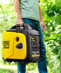 Man holding 2550W Portable Inverter Generator For Home Use With 1.06 Gallon Fuel Tank And Up To 10 Hours Runtime 120V Gas Powered
