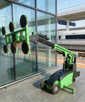 Heavy Duty Vacuum Suction Lifter Trolley For Glass And Stone Panel Installation Built Tough To Handle Massive Loads With Zero Hassle On Any Professional Job Site Project, positioned against glass exterior.