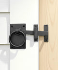 Black Wrought Iron Gate Ring Turn Latch Lock Set 6.5 Inch Wide Reversible Barn Door Catch installed on door.