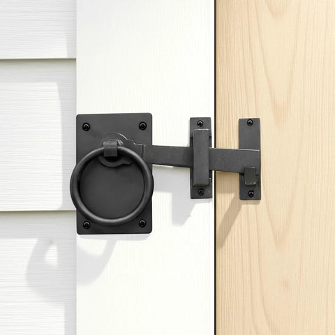 Black Wrought Iron Gate Ring Turn Latch Lock Set 6.5 Inch Wide Reversible Barn Door Catch installed on door.