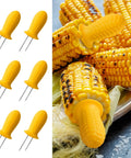 Stainless Steel 19 Piece BBQ Tools Set with 6 yellow corn forks on grilled corn.