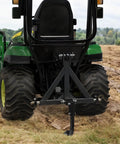 Beast Hitch Mounted Ripper And Subsoiler For 2 Inch Receiver attached to green tractor on field