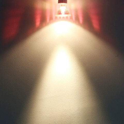 Focused light beam from MR16 50W 12V Halogen Light Bulb With GU5.3 Base, 720 Lumens, showing dimmable spotlight effect on wall
