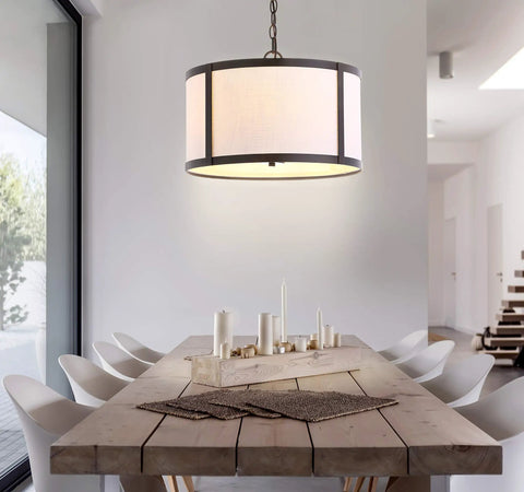 Oil Rubbed Bronze LED Pendant Light For Kitchen Island With White Linen Drum Shade above dining table