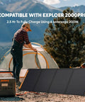 Person setting up a campsite with SolarSaga 200W Portable Foldable Bifacial Solar Panel IP68 next to power station in outdoor setting.