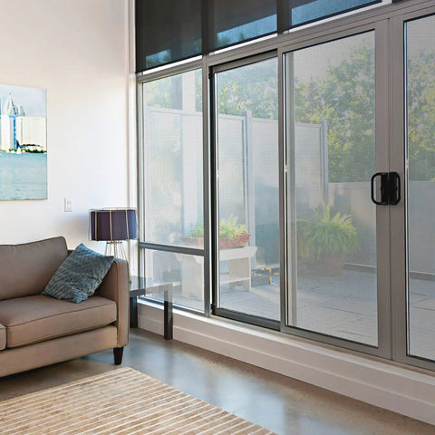 Living room view with Stainless Steel Window Screen Roll 36x200 Inches With Stab-Resistant Gloves Pet Proof Mesh Replacement installed.