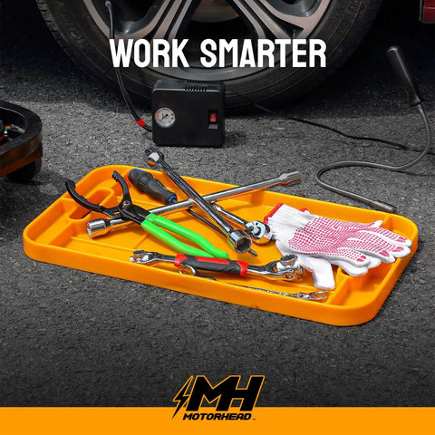 Silicone Tool Tray Set 4 Piece Magnetic Non Slip Anti Scratch Heat Resistant Up To 248F 120C Non Conductive Anti Static Orange Garage Organization 23 Inch 16 Inch 12 Inch 4 Inch filled with tools on the ground.