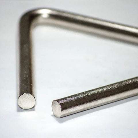 Triangle Percussion Instrument Handcrafted In USA By Nashville Small Biz, Premium Alloy Triangle For Rich, Warm Chime Tone, Supports American Jobs, Made In Tennessee Music Gear. close-up of metal triangle corner