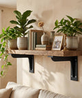 Heavy Duty L Shelf Brackets Set supporting wood shelf with plants and books, installed in a cozy living space.