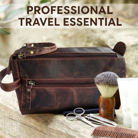 Genuine Full Grain Leather Toiletry Bag For Men Slick Travel Dopp Kit and Shaving Organizer on wooden surface with grooming tools.