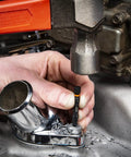 Person using 10 Piece Bolt Biter Screw Extractor Set for stuck fasteners on machinery, bi-directional design, tapered cutting edges.