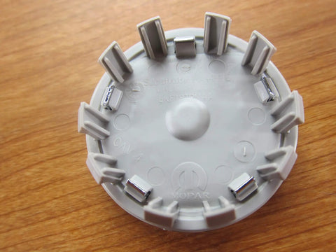 Back view of Silver Ram 1500 DT Wheel Center Cap With Ram Logo OEM Replacement For 2019 New Body Style Direct Fit Factory Spec