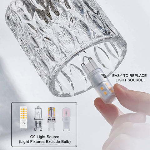 Close-up of crystal glass vanity light from Sleek Modern Bathroom Light Fixtures With Three Crystal Glass Vanity Lights Over Mirror In Brushed Nickel Finish G9 Bulb Not Included Ideal For Master Ensuite Powder Room Easy To Install Durable Design