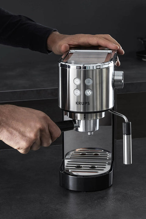 Semi Automatic Espresso Coffee Maker With Built In Steam Wand And High Pressure Pump For Rich Creamy Shots being used on a kitchen counter.