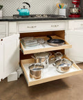 Heavy Duty Custom Fit Slide Out Shelf With Full Extension Glide Rails For Kitchen Cabinets, displaying pots and dishes in a cabinet.