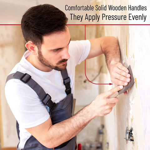 Man using Five Piece Paint Scraper And Putty Knife Set With Five In One Tool For DIY Home Improvement Pro Grade on wall