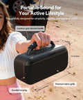 Person holding Portable Bluetooth Speaker 100W Peak Power 60W RMS SoundPulse 2.0 BassBoost Waterproof Party Speaker With True Wireless Stereo TWS Unlimited Pairing Ideal For Outdoor Indoor Beach Vacation Black with comfort-grip silicone handle and premium fabric grille.