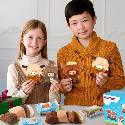 Kids holding Highland Cow keychains made with Awesome Three Pack Needle Felting Kit For Beginners With Wool Felt Tools.