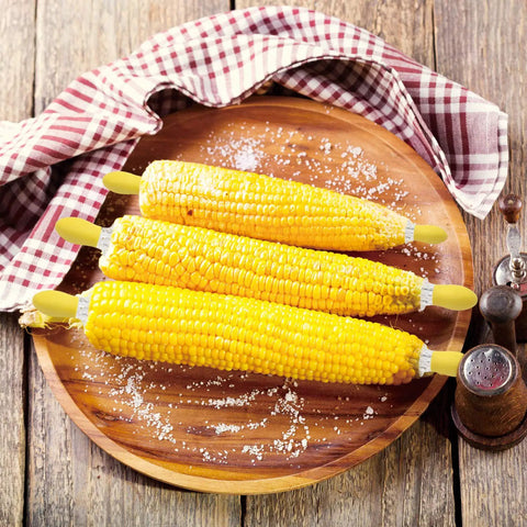 Three cobs on plate with Twin Prong Corn Cob Holders And Butter Spreader Set For Barbecue Safe Grip Stainless Steel Skewers