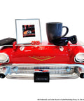1957 Chevrolet Bel Air Floating Wall Shelf With LED Headlights Tempered Glass Display Surface For Die Cast Cars Photos Collectibles And Small Plants Dope Vintage Red Car Decor For Man Cave Or Garage featuring a red car front design with sunglasses and a mug on display.