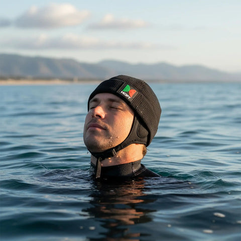 Person wearing Thermal Neoprene Hood Cap For Freediving And Sea Swimming With Adjustable Chin Strap Beanie Hat Black Large