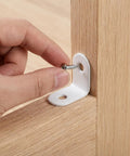 Hand installing screw into Stainless Steel Right Angle Corner Brackets With Screws, 24 Pack, L Shaped Braces for wood shelves.