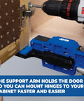 Cabinet Door Mounting Jig For Frameless And Face Frame Cabinets in use, showing adjustable blue support arm holding a cabinet door in place.