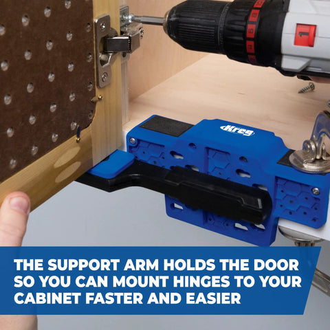 Cabinet Door Mounting Jig For Frameless And Face Frame Cabinets in use, showing adjustable blue support arm holding a cabinet door in place.