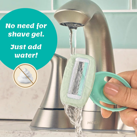 Intuition Go Disposable Razor For Sensitive Skin With BuiltIn Moisturizing Aloe Bar 4Fold Pivoting Head shown under running faucet