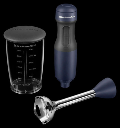 Smooth Operator Two Speed Hand Blender Featuring BPA Free Stainless Steel Blades For Quick Chopping Pureeing And Effortless Mixing In Classic Ink Blue, including blending shaft and measuring jar.