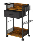Black mobile salon trolley cart on wheels for hair stylists with metal tool holder, basket, and fabric drawer in durable steel.