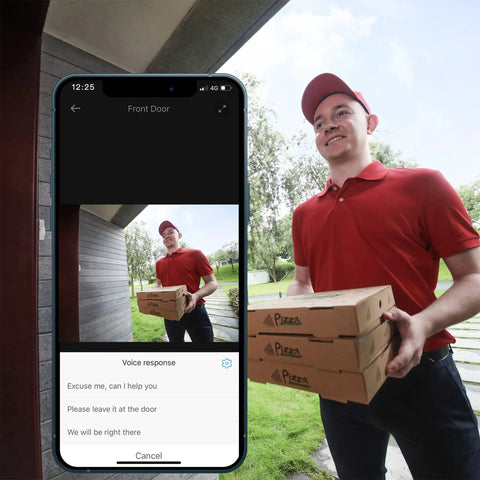 Delivery person holding pizzas visible on phone displaying Battery Powered Video Doorbell 2E With 2K Live View, Wide Dynamic Range, 4:3 Color Image For A Crisp Head To Toe Look, And 120 Day Front Door Security With Low Power Wireless HomeBase at front door