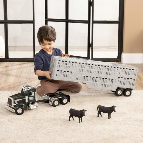 Child playing with Peterbilt 1 By 16 Scale Semi Truck With Livestock Trailer And Four Cows, Realistic Engine Sounds And Working Lights