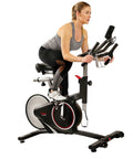 Smooth Riding Indoor Cycling Bike Featuring Forty Pound Rear Flywheel And Digital Console To Dominate Your Daily Grind And Ride With Silent Magnetic Resistance Upgrading Your Whole Home Gym Setup, woman exercising on bike.