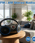 Portable CD Player Boombox With Top-Loading Disc, 20-Track Programmable Memory on a table in a modern living room