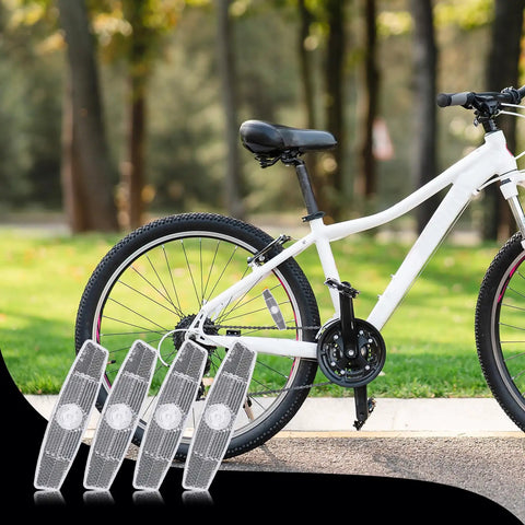 4 Pack Bike Wheel Reflectors For Night Riding Bicycle Spoke Reflectors For Mountain And Road Bikes with a white bicycle in background.