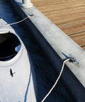 Top Shelf 8 Inch Galvanized Cast Iron Boat Dock Cleat Rigged Up For Heavy Duty Marine Tie Downs with kayak docked.