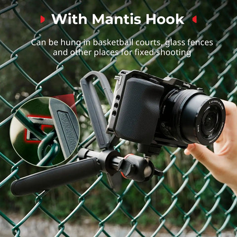 Camera mounted on Versatile Extendable Mini Camera Tripod Selfie Stick with carabiner grip and mantis hook on fence