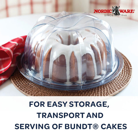 Deluxe Bundt Cake Keeper in crystal clear plastic displaying Bundt cake with icing, lid locks for easy transport, dishwasher safe