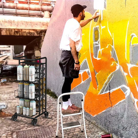 Heavy Duty Metal Spray Paint Storage Rack Eight Tier Lube Can Organizer with paint cans in use beside artist painting a wall.